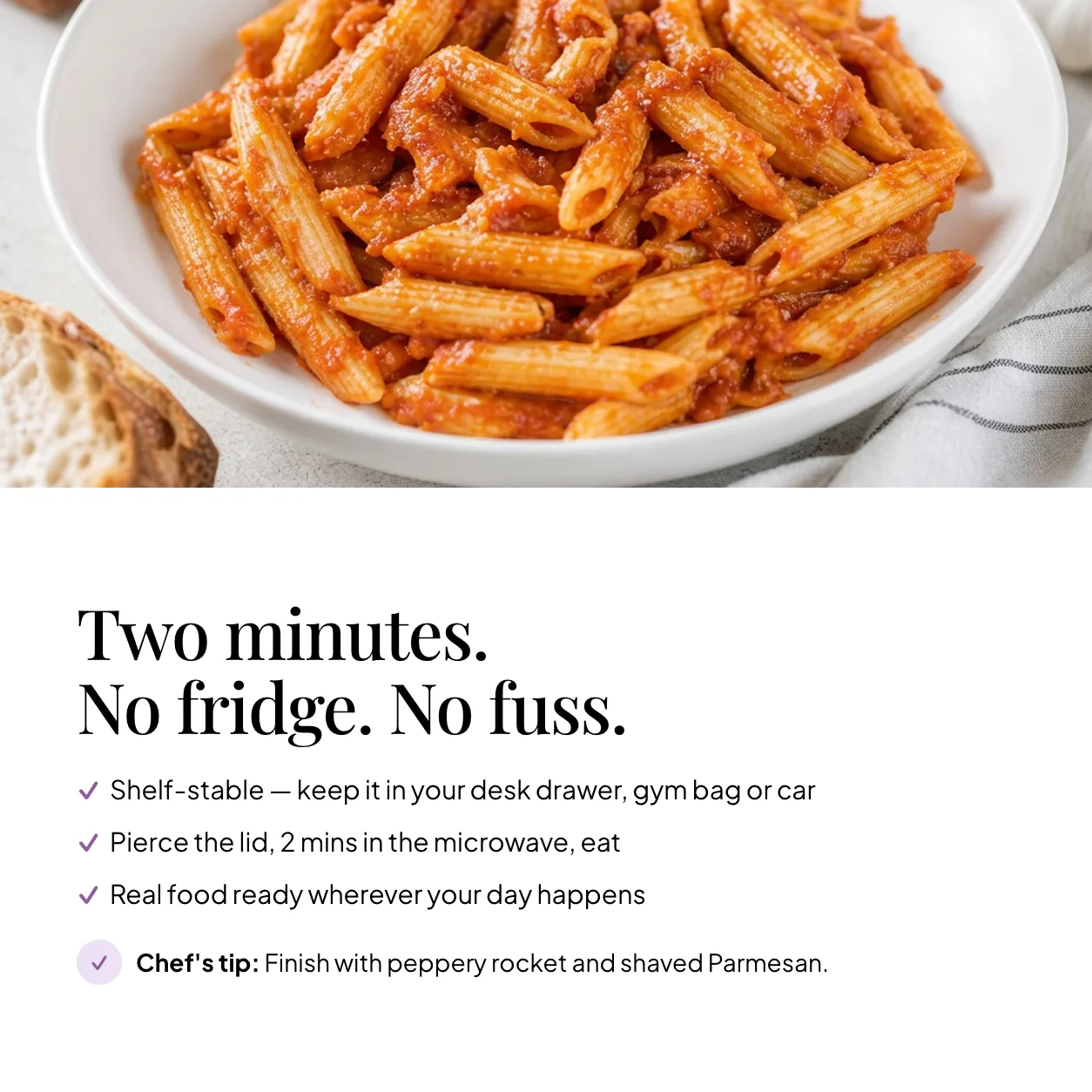 Bowl of EatProtein penne arrabbiata ready meal — shelf stable, pierce the lid and microwave for 2 minutes; chef's tip: finish with peppery rocket and shaved Parmesan