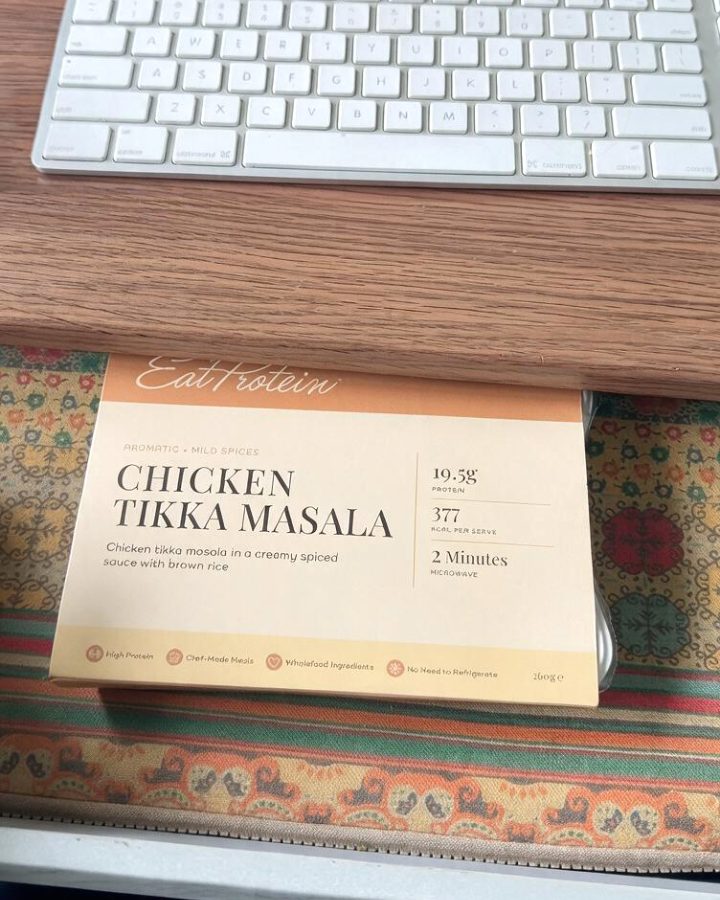 Chicken tikka masala ready meal in a desk drawer under a keyboard